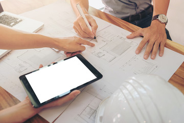 Image of engineer or architectural project, two engineering discussing and working on blueprint with architect equipment, Construction concept