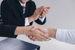 © Freedomz - greeting new colleagues, Handshake while job interviewing, male candidate shaking hands with Interviewer or employer after a job interview, employment and recruitment concept