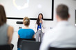© ReeldealHD images - Businesswoman giving training to colleagues in conference room