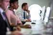 © ReeldealHD images - Businessman using computer in crowded office