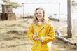 © Scandinav - woman in yellow raincoat