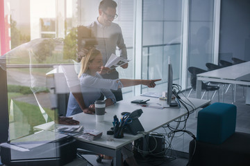 Wall Mural - Business people using technology and having conversation. Business people at the office.