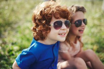 Wall Mural - cute stylish children in summer park