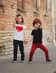 Wall Mural - little boy and girl on the street