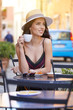 © ZoomTeam - woman having italian coffee at the cafe on the street in Toscana city. Soft focus with small depth of field