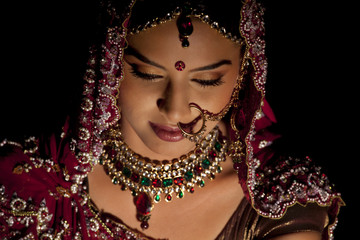 Wall Mural - Close-up of Indian bride in wedding attire and jewelery 