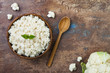 © sveta_zarzamora - Cauliflower rice in a bowl. Top view, overhead, copy space