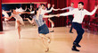 © JackF - Adult dancing couples enjoying active swing