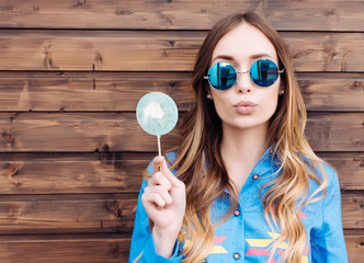 Cool hipster student woman wearing eyewear glasses . Caucasian female university student looking at camera smiling happy.