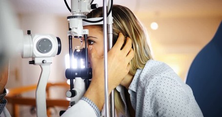 Wall Mural - Checking eyesight in a clinic. Ophthalmology. Medicine and health concept.