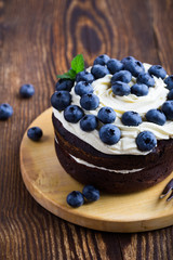 Wall Mural - Berries chocolate layer cake with blueberries