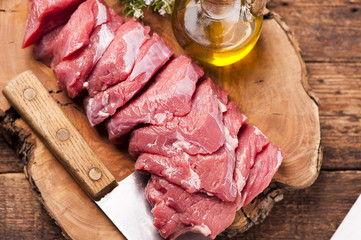 fresh raw meat on old wooden table