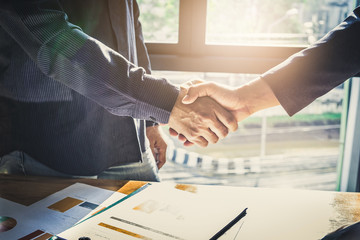 Business partnership meeting concept. Image businessmans handshake. Successful businessmen handshaking after good deal. Group support concept.