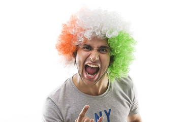 Young man with a wig shouting 