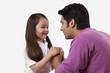 © IndiaPix - Father and daughter holding hands over white background