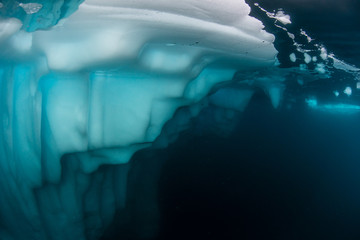 underwater view of icebergs in scores bysund fjord, east greenland.