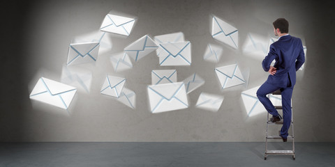 Wall Mural - Businessman using email interface on a wall 3D rendering