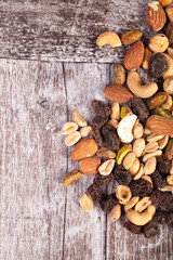 Delicious Mix of healthy raw nuts on wooden background in studio photo. Healthy organic snack