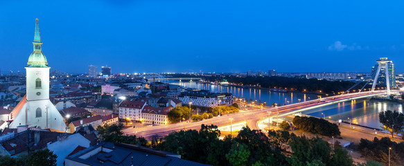 Wall Mural - Panoramic view of Bratislava city with St. Martin's Cathedral and Danube river at night