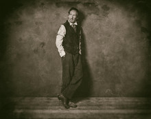 Classic Wet Plate Photo Of Vintage 1900 Western Man Leaning Against Wall.
