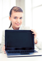 Poster - businesswoman with laptop in office