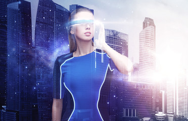 Wall Mural - woman in virtual reality glasses over space city