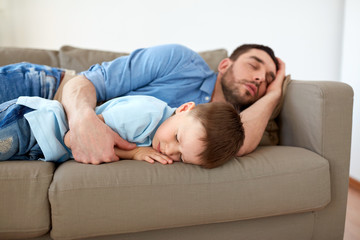 Poster - happy father and son sleeping on sofa at home