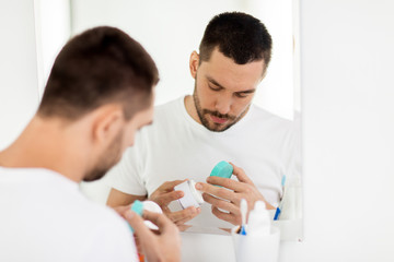 Poster - young man with cream at bathroom