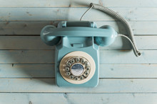 A Blue Retro Telephone On A Blue Background