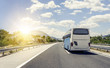 canvas print picture - Bus rushes along the asphalt high-speed highway.