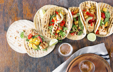 Wall Mural - Corn tortillas with grilled chicken fillet, guacamole sauce and beer