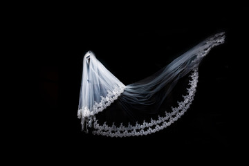 wedding white bridal veil on black background isolated