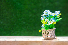 Artificial Of Colorful Flower In A Old Vase On Wooden Table. - Shallow Of Focus