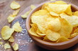 Potato chips in bowl. Fast food.