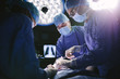 © Jacob Lund - Professional surgeons performing surgery in operating room