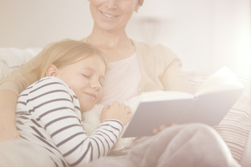 Canvas Print - Girl falling asleep while reading book