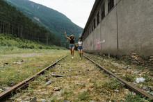 Women Running On Railway