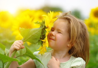 Wall Mural -  girl and sunflower on the field