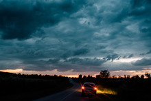 Dramatic Sky With Car On The Road