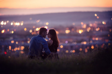 Lovers man and girl against background night city, night starry sky and horizon. Concept date Valentine's Day, first kiss love, forever together.