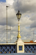 The famous old ornate Victorian gas street lamps that decorate the Queen Victoria Bridge in belfast Northern Ireland. These lamps are cast iron and are heavily decorated with fish representations
