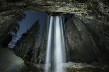 Low Angle View Of Waterfall At Hanging Lake During Night