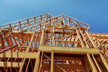 wood framework of new residential home under construction.