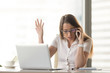 © fizkes - Disgruntled angry businesswoman arguing on mobile sitting at workplace, having problem of conflict during phone negotiations, disagreeing by cell, shouting and gesturing while speaking on smartphone