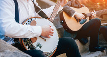 View Of Musician Playing Banjo At The Street