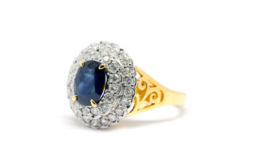 Closed up Blue Sapphire  with white diamond and gold ring isolated