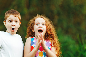 Surprised little children smile and happy in summer outdoor.