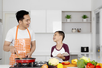 Father with child in the kitchen