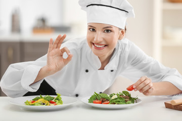 Sticker - Young female chef with tasty dishes in kitchen