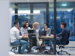 © .shock - Startup Business Team At A Meeting at modern night office building